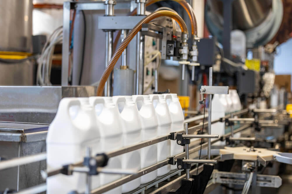 H27A5670-scaled Amber bottles being filled on automated line.