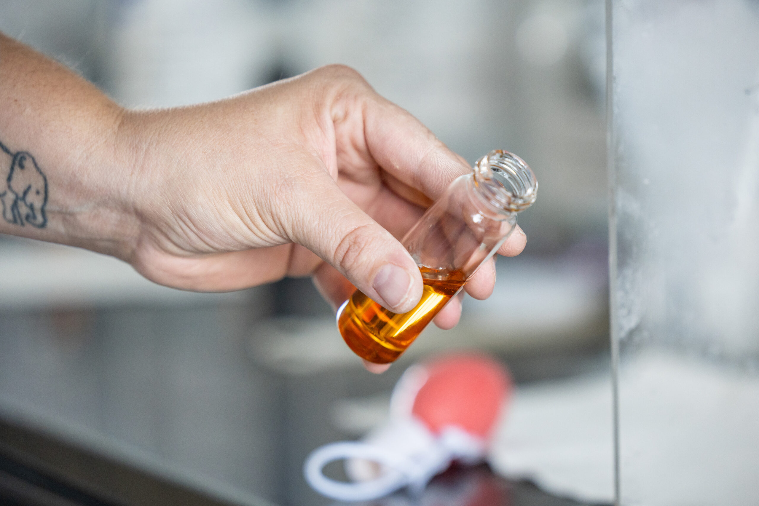 H27A6039 Amber bottles being filled on automated line.